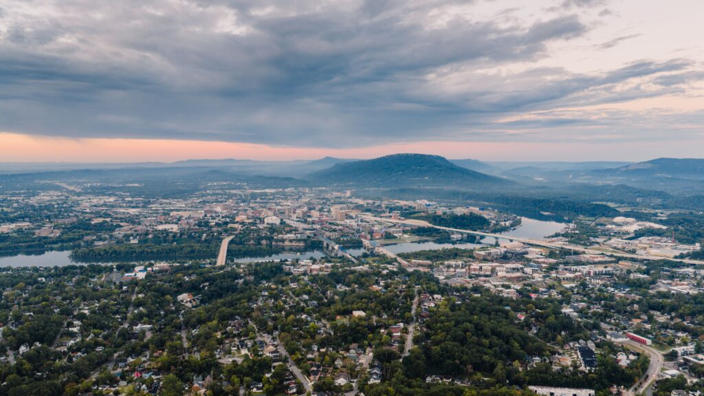 Breathtaking aerial view of Chattanooga, Tennessee showcasing cityscape and scenic mountains at dawn.