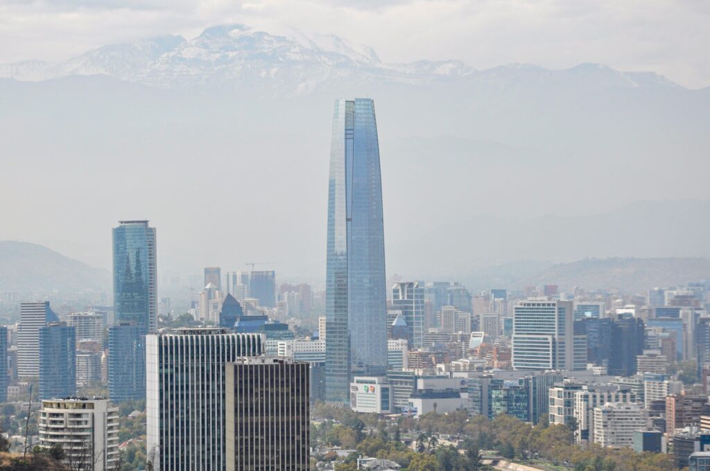 A panoramic view of Santiago's skyline featuring the majestic Sky Costanera Tower.